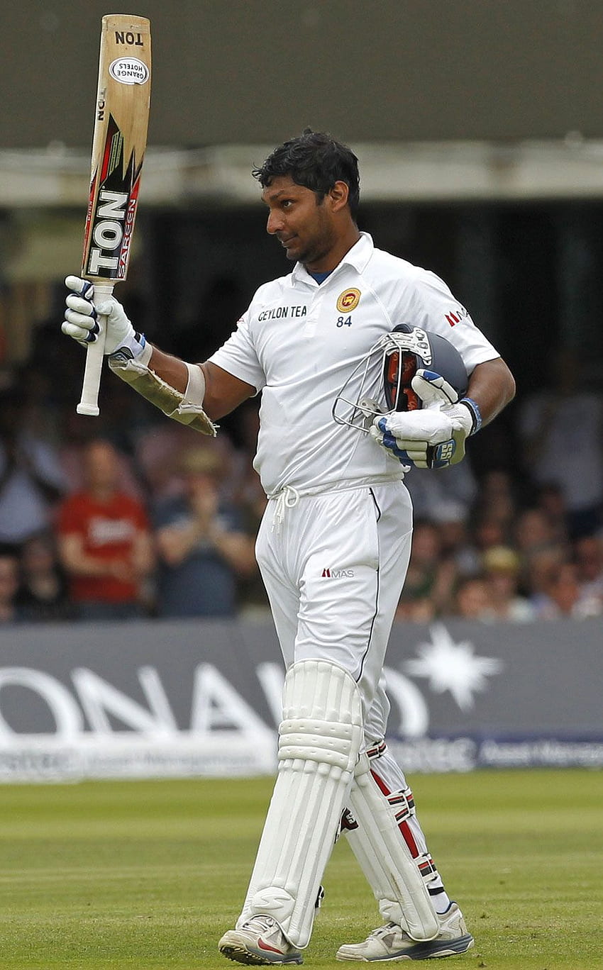 KUMAR SANGAKKARA holding a cricket bat